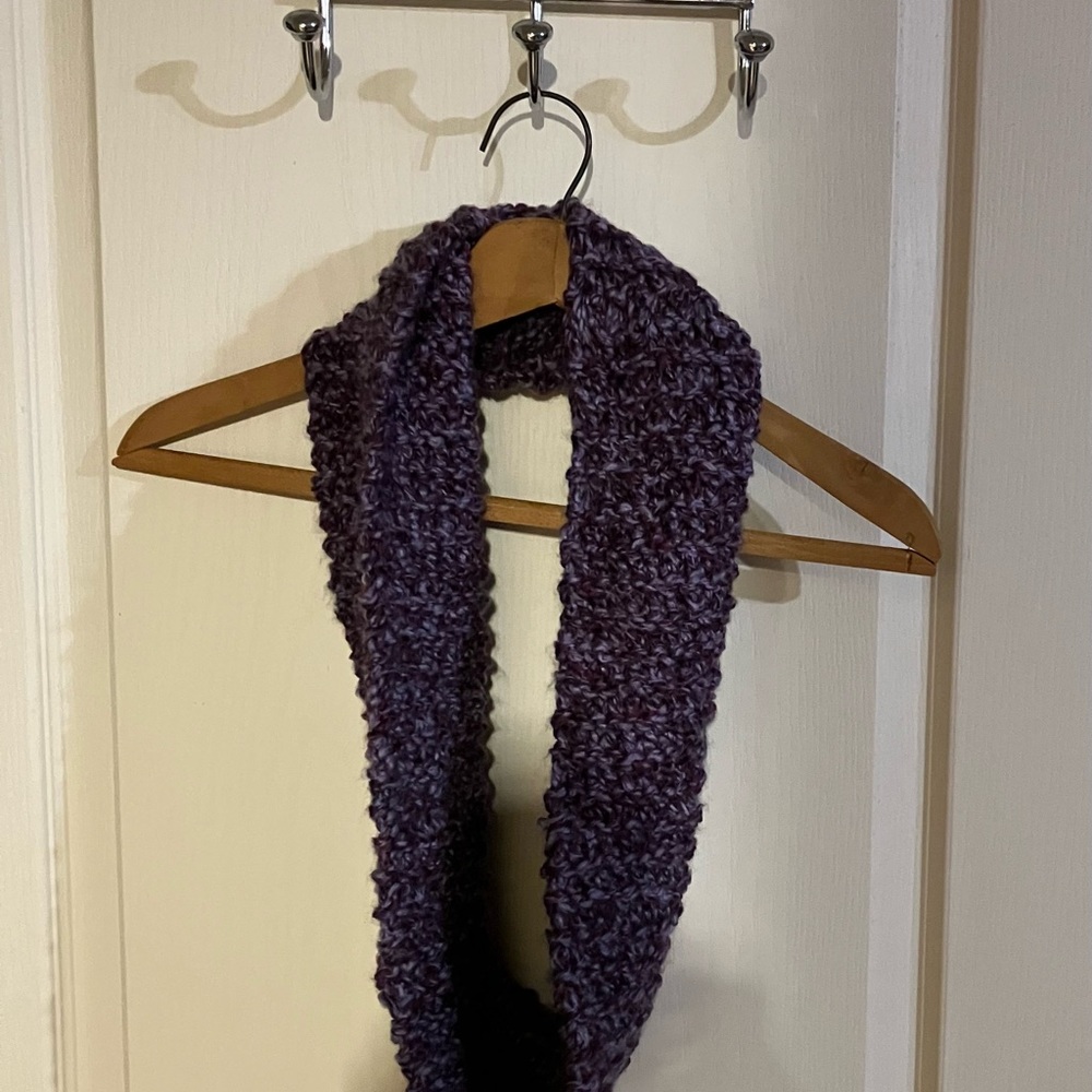 Hand crafted infinity scarf. Multicolored with shades of purple.